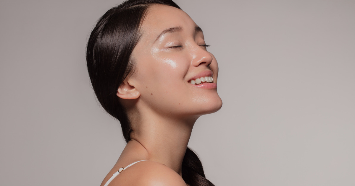 A joyful woman with a flawless face.